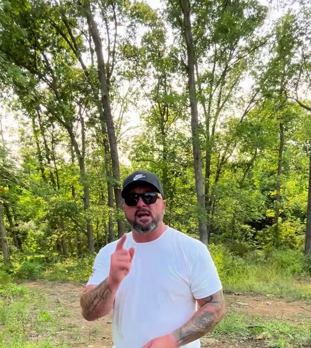 Mother Nature Tree Service arborist on site along a fence line in Berryville, VA