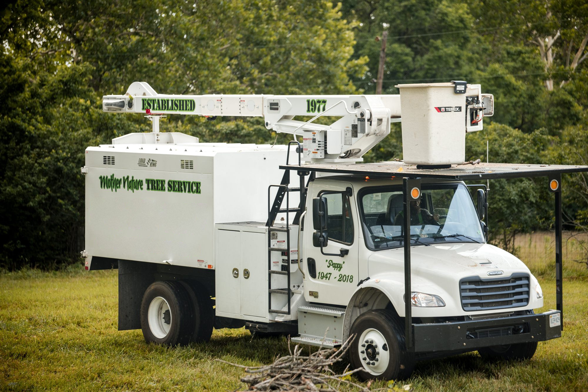 Mother Nature Tree Service truck fleet staged for a Winchester, VA job