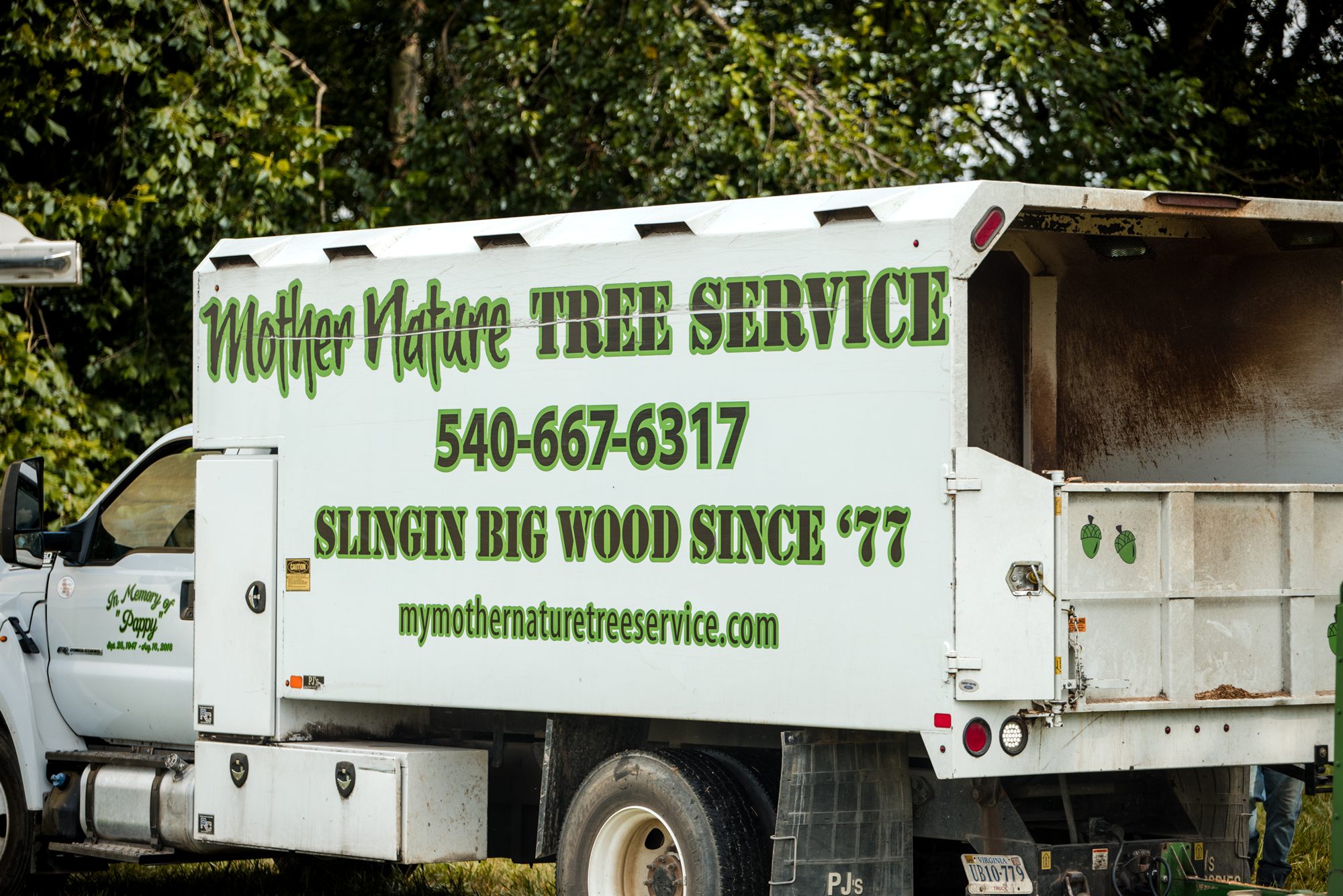 Mother Nature Tree Service chip truck with the painted lettering and the In Memory of Pappy decal