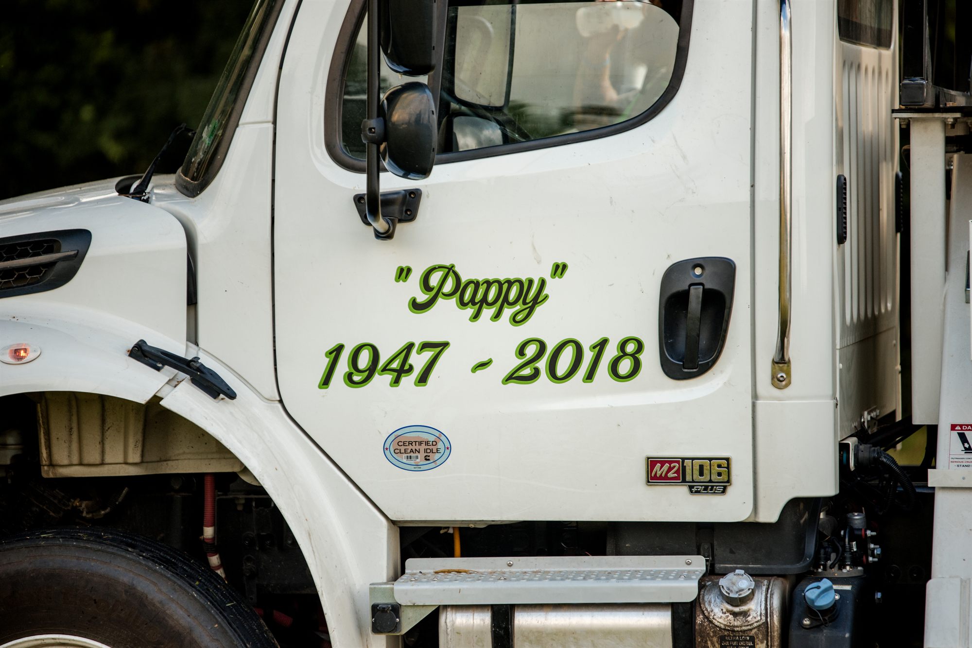 A decal on a truck cab door reading Pappy with the years 1947 to 2018