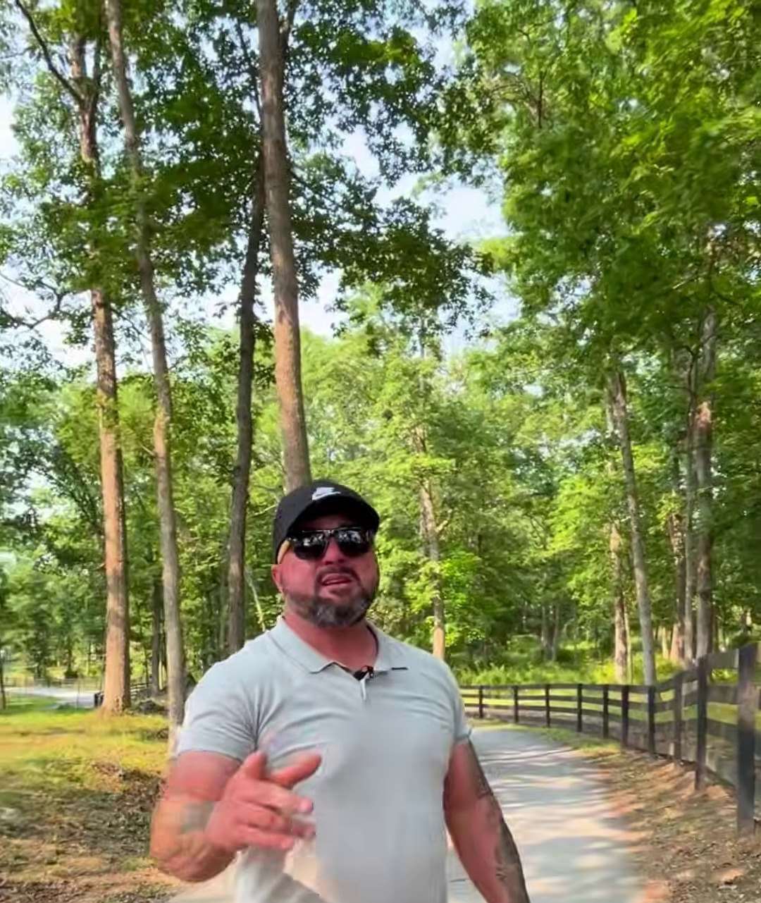 Arborist walking a property in Winchester, VA assessing tree health before treatment