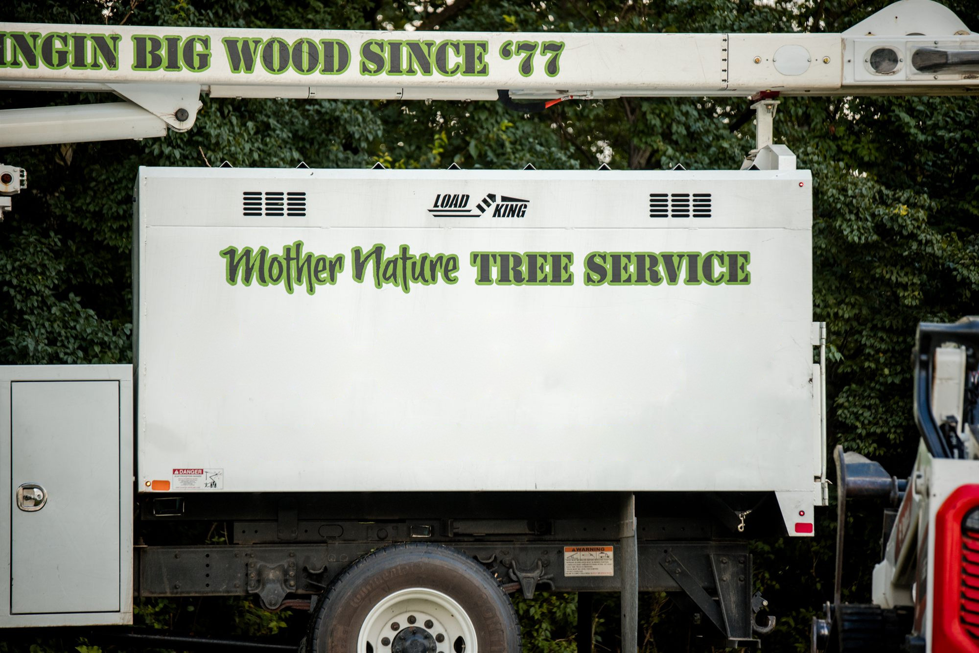 Close view of the painted lettering on the side of the truck body